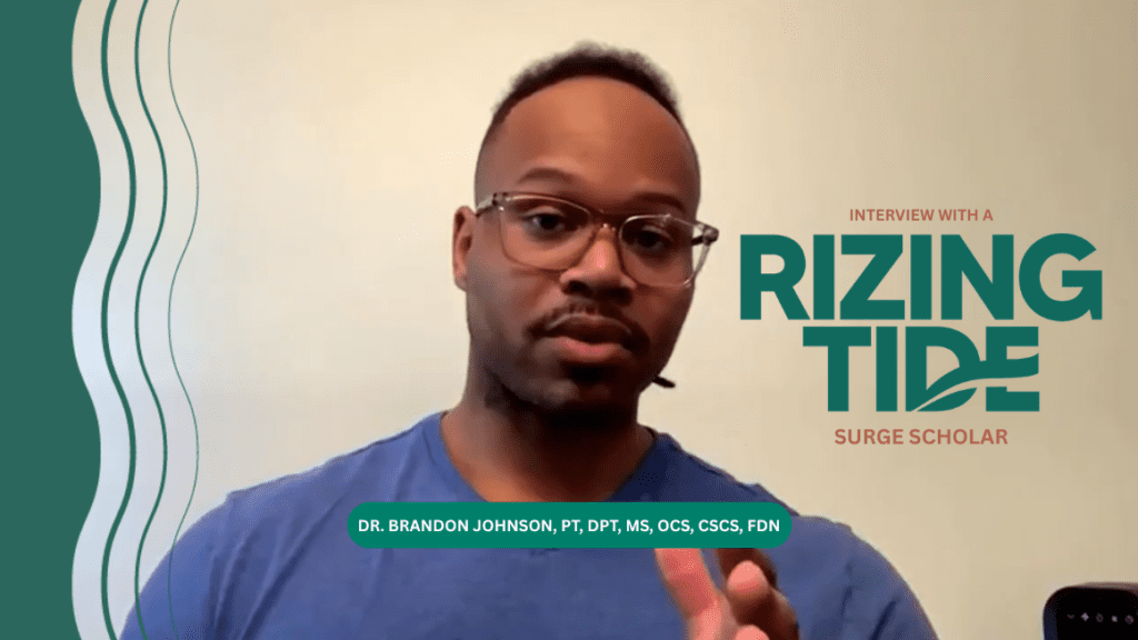 An interview screenshot of Brandon Johnson, mid speech, gesticulating toward the camera. A text overlay reads "An interview with a Rizing Tide Surge scholar. Dr. Brandon Johnson, PT, DPT, MS, OCS, CSCS, FDN."