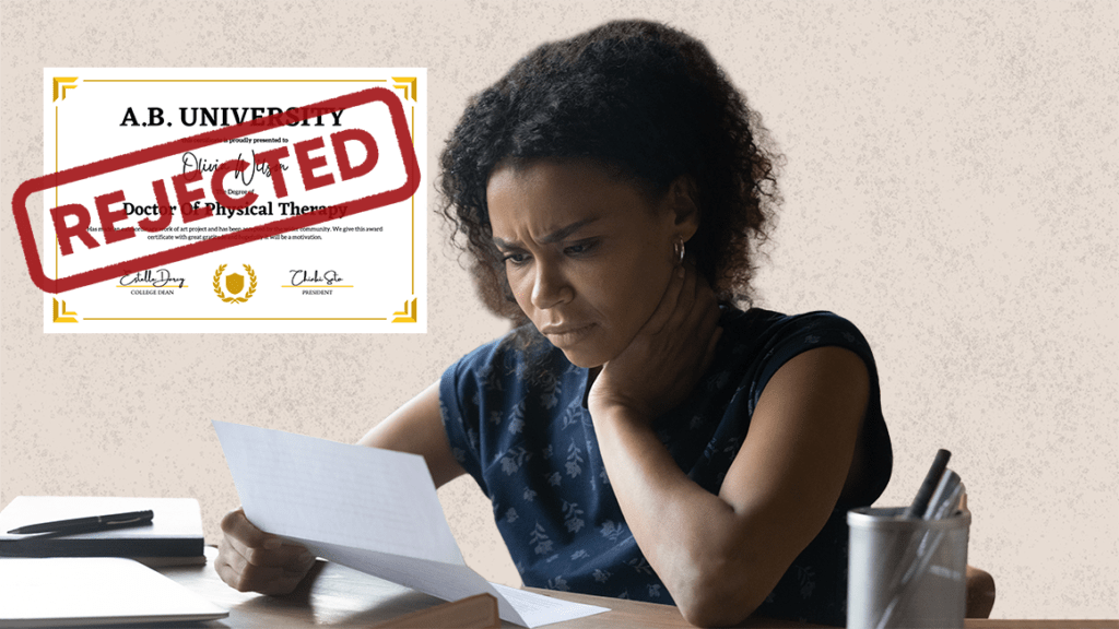 Disappointed woman looks down at rejected university application