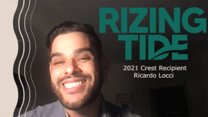 Webcam image of Ricky Locci with caption reading "Rizing Tide 2021 Crest Recipient Ricardo Locci"