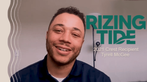 Webcam image of Tyrell McGee with caption reading "Rizing Tide 2021 Crest Recipient Tyrell McGee"